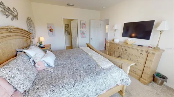 a spacious bathroom with a double vanity sink a mirror and a shower