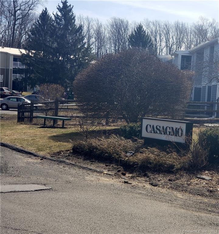 47 Olcott Way, Unit 47 Ridgefield, CT 06877 - Photo 1 of 1 a sign that is on the side of a road