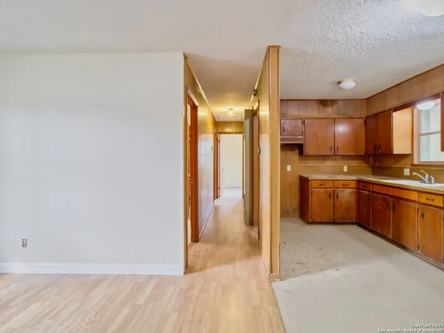 a kitchen with stainless steel appliances a refrigerator and a sink