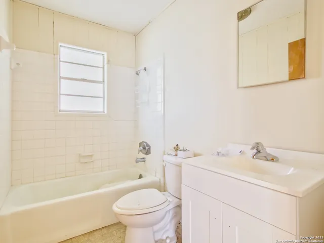 a bathroom with a sink toilet and bathtub