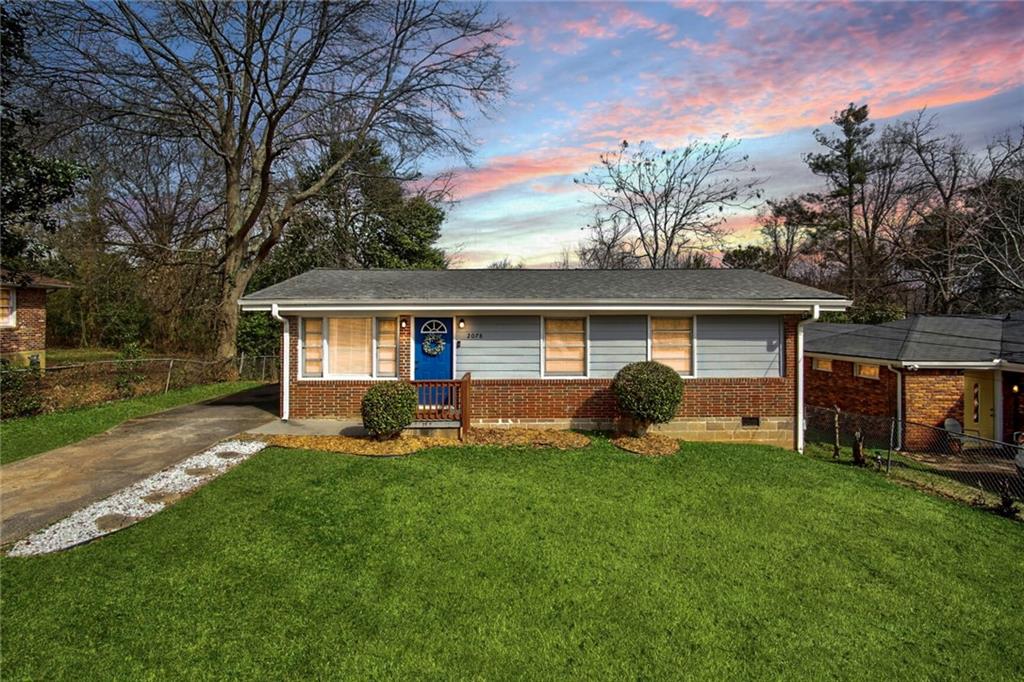 2078 Parker Ranch Road Southeast Atlanta, GA 30316 - Photo 1 of 1 front view of a house with a yard