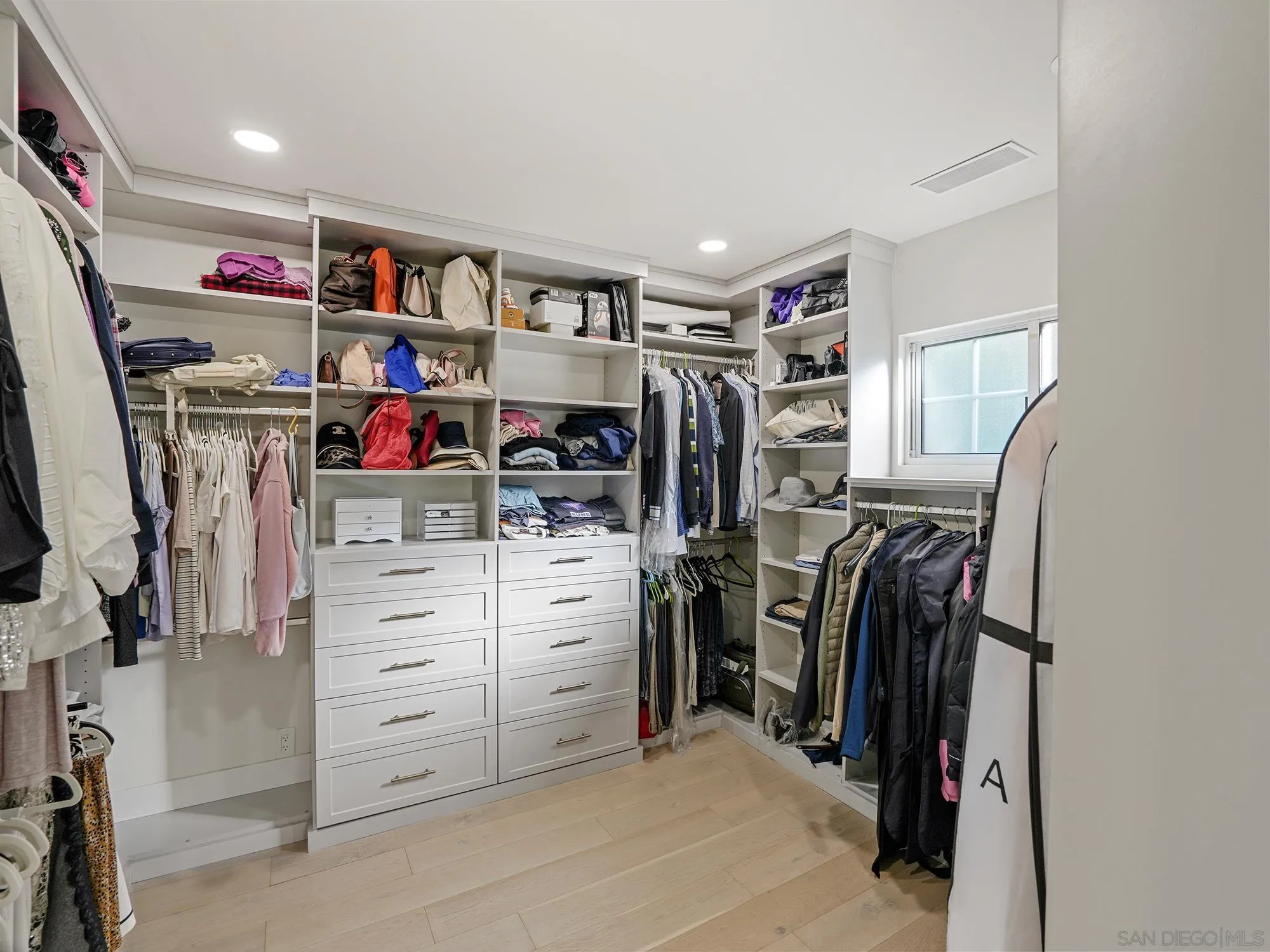 17515 Circa Oriente Rancho Santa Fe, CA 92067 - Photo 20 of 34 Nicely built out walk in closet in the primary bedroom