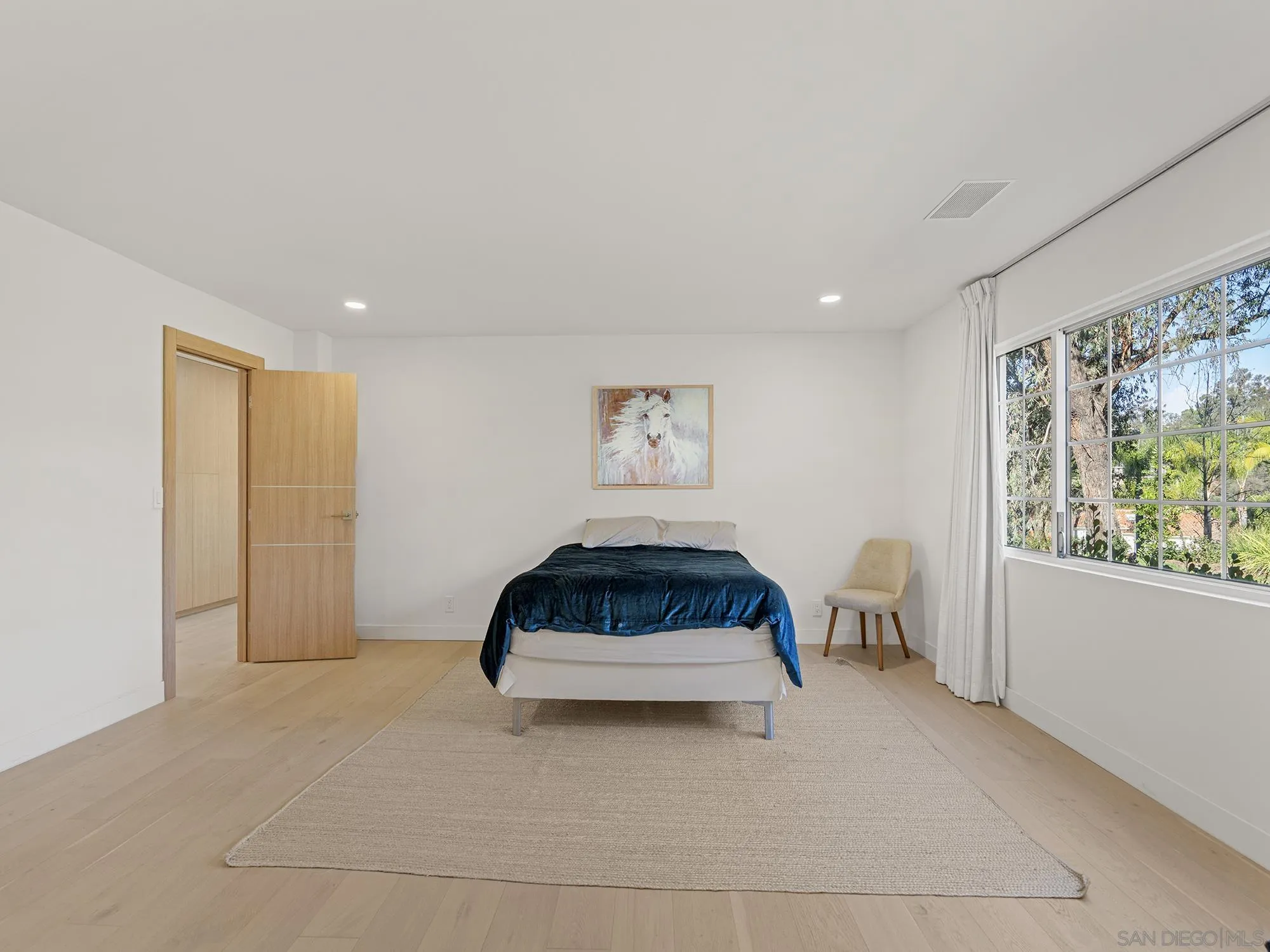 17515 Circa Oriente Rancho Santa Fe, CA 92067 - Photo 22 of 37 a living room with furniture and a window