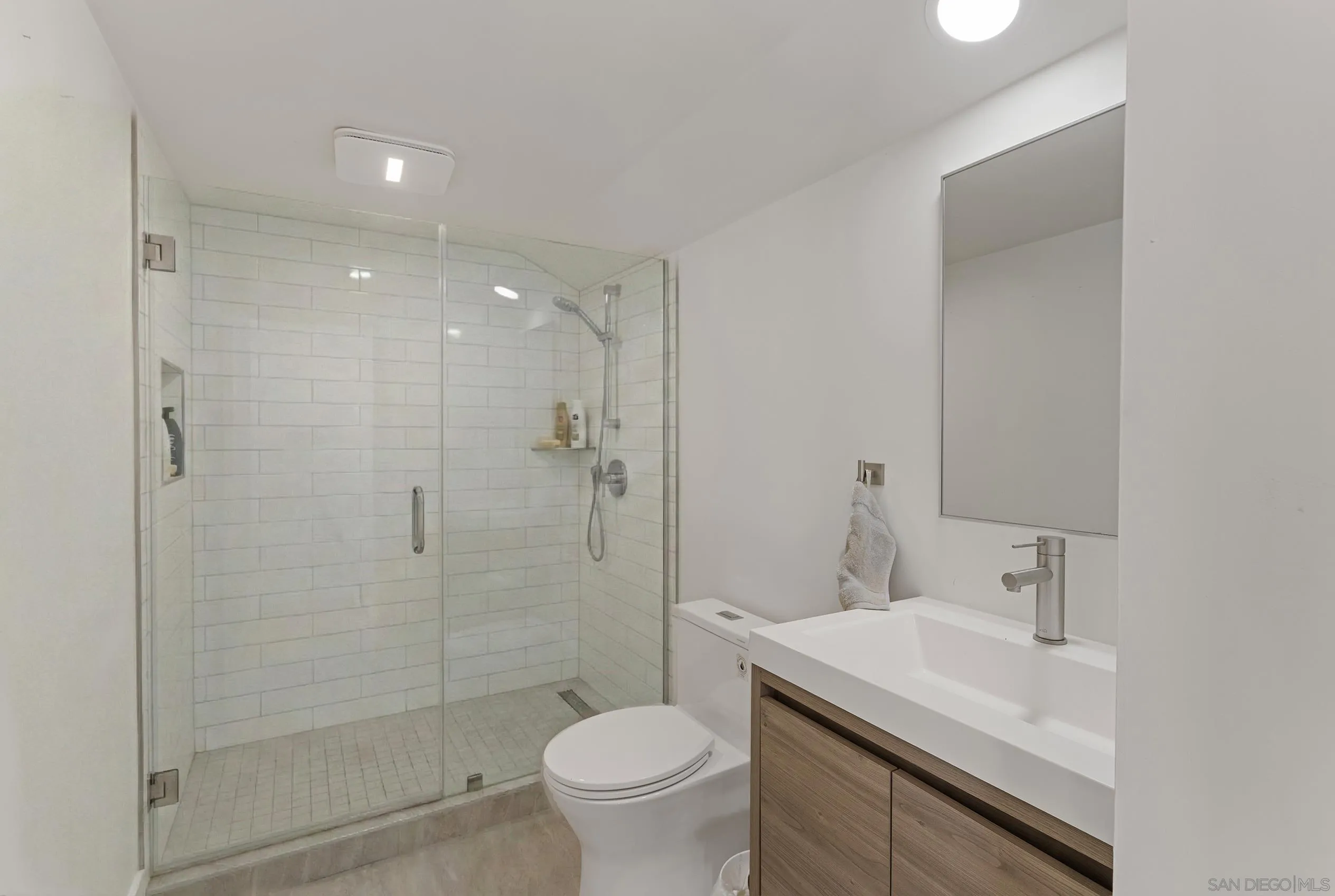 17515 Circa Oriente Rancho Santa Fe, CA 92067 - Photo 30 of 37 a bathroom with a sink toilet and shower