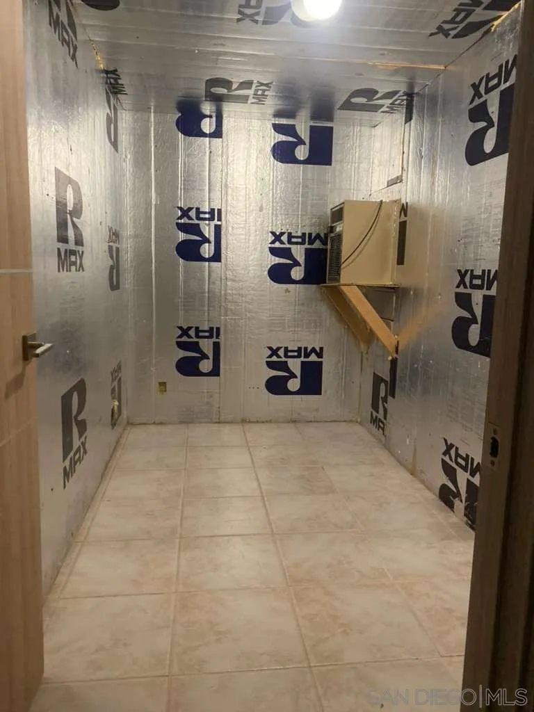 17515 Circa Oriente Rancho Santa Fe, CA 92067 - Photo 30 of 34 This room is insulated and has the Breeezaire cooling unit in it ready to be built out