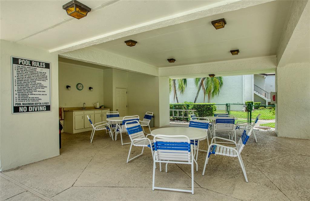 700 Starkey Road, Unit 1145 Largo, FL 33771 - Photo 46 of 63 a dining room with furniture and a large window