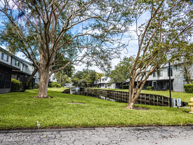 a view of a house with a back yard