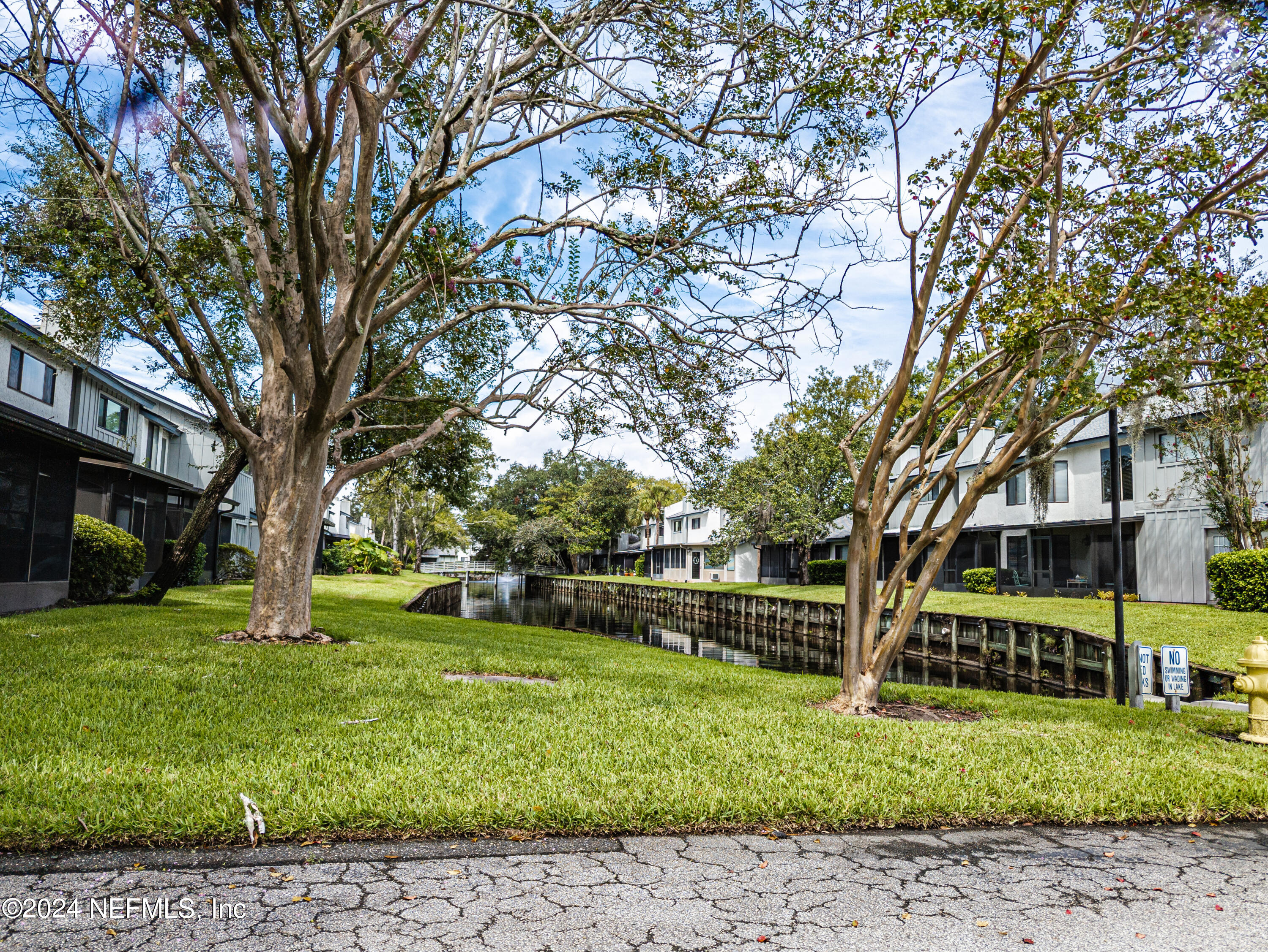9360 Craven Road, Unit 504 Jacksonville, FL 32257 - Photo 23 of 28 a view of a house with a back yard