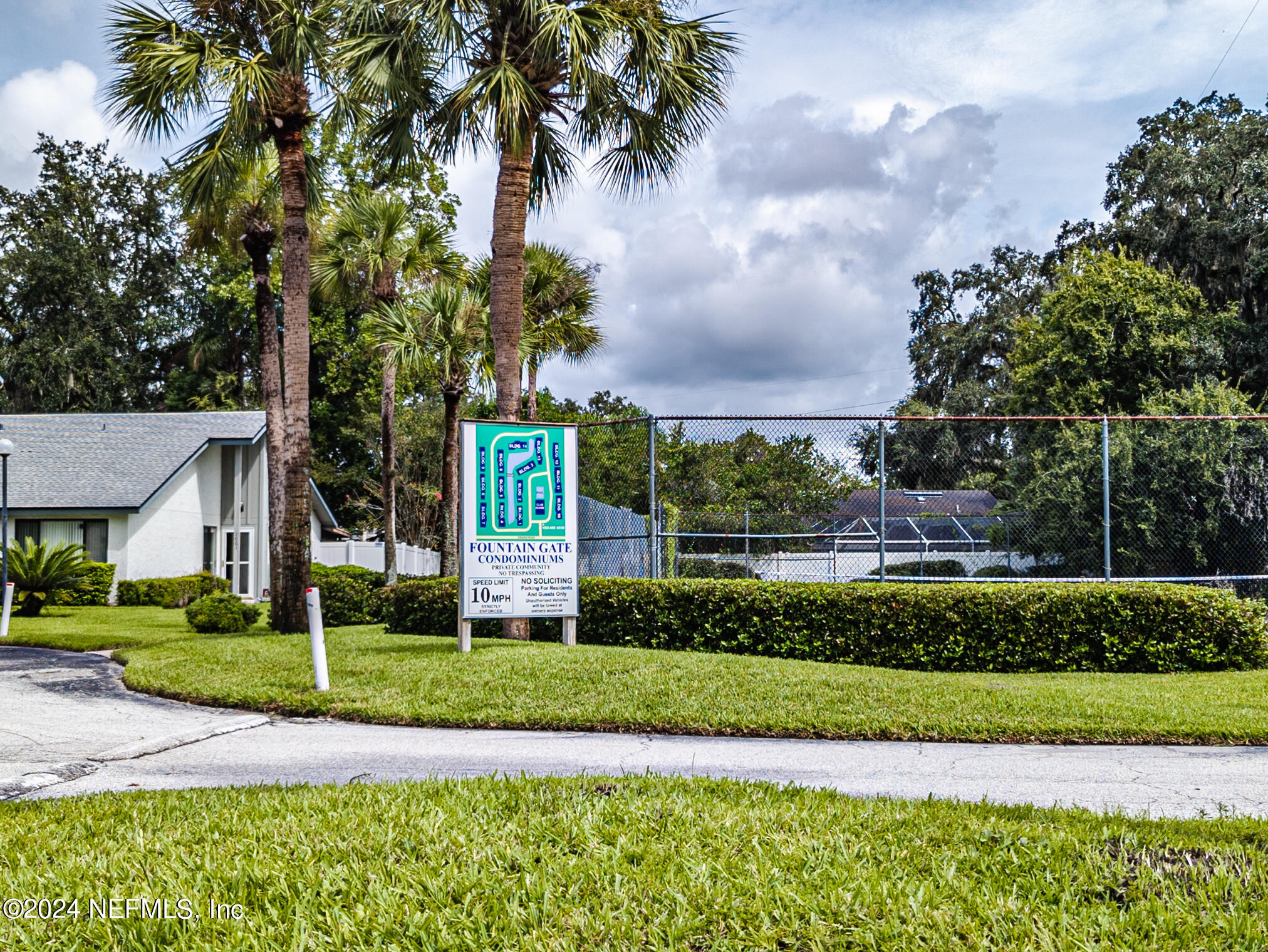 9360 Craven Road, Unit 504 Jacksonville, FL 32257 - Photo 25 of 28 a front view of a house with a yard