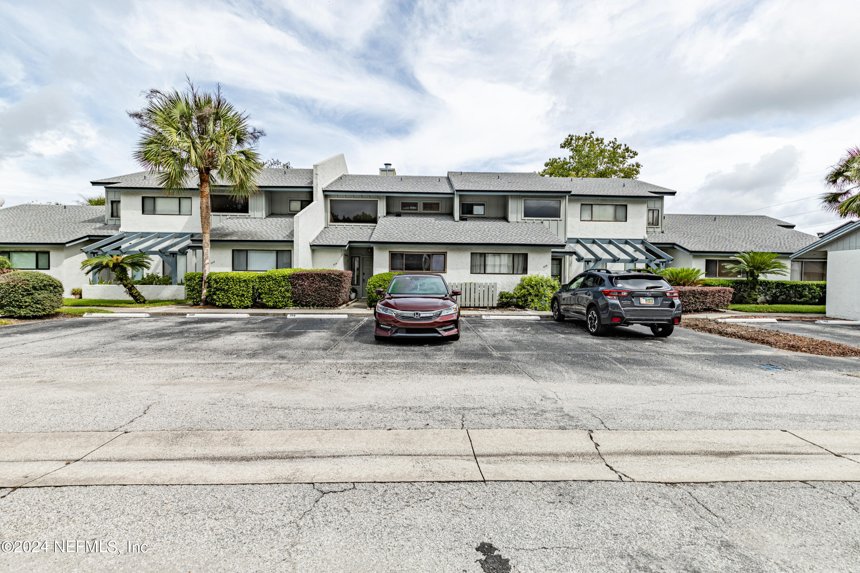 9360 Craven Road, Unit 504 Jacksonville, FL 32257 - Photo 28 of 28 a car parked in front of a building