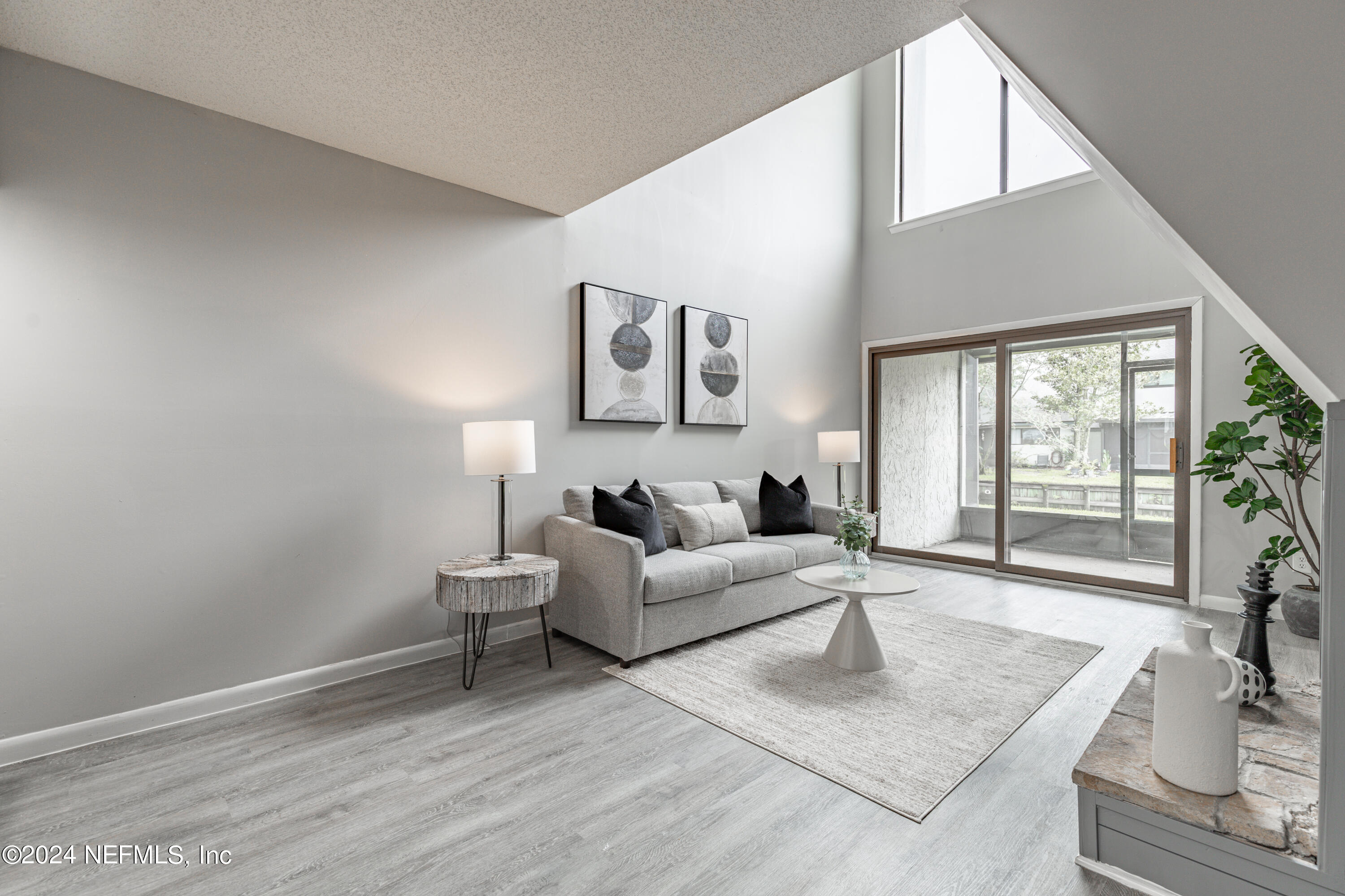 9360 Craven Road, Unit 504 Jacksonville, FL 32257 - Photo 6 of 28 a living room with furniture and a large window