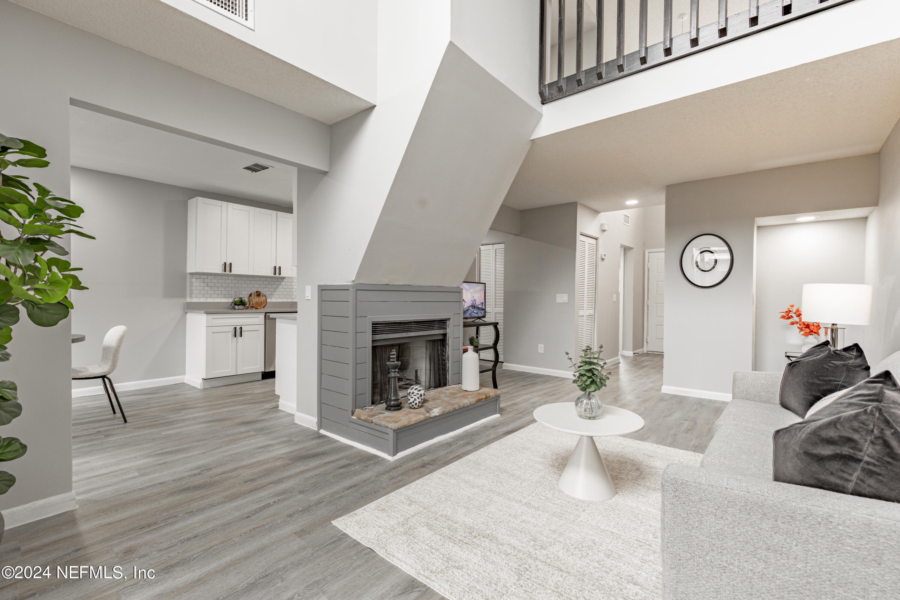 9360 Craven Road, Unit 504 Jacksonville, FL 32257 - Photo 7 of 28 a living room with furniture and a fireplace