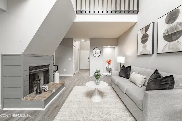 a living room with furniture and a fireplace