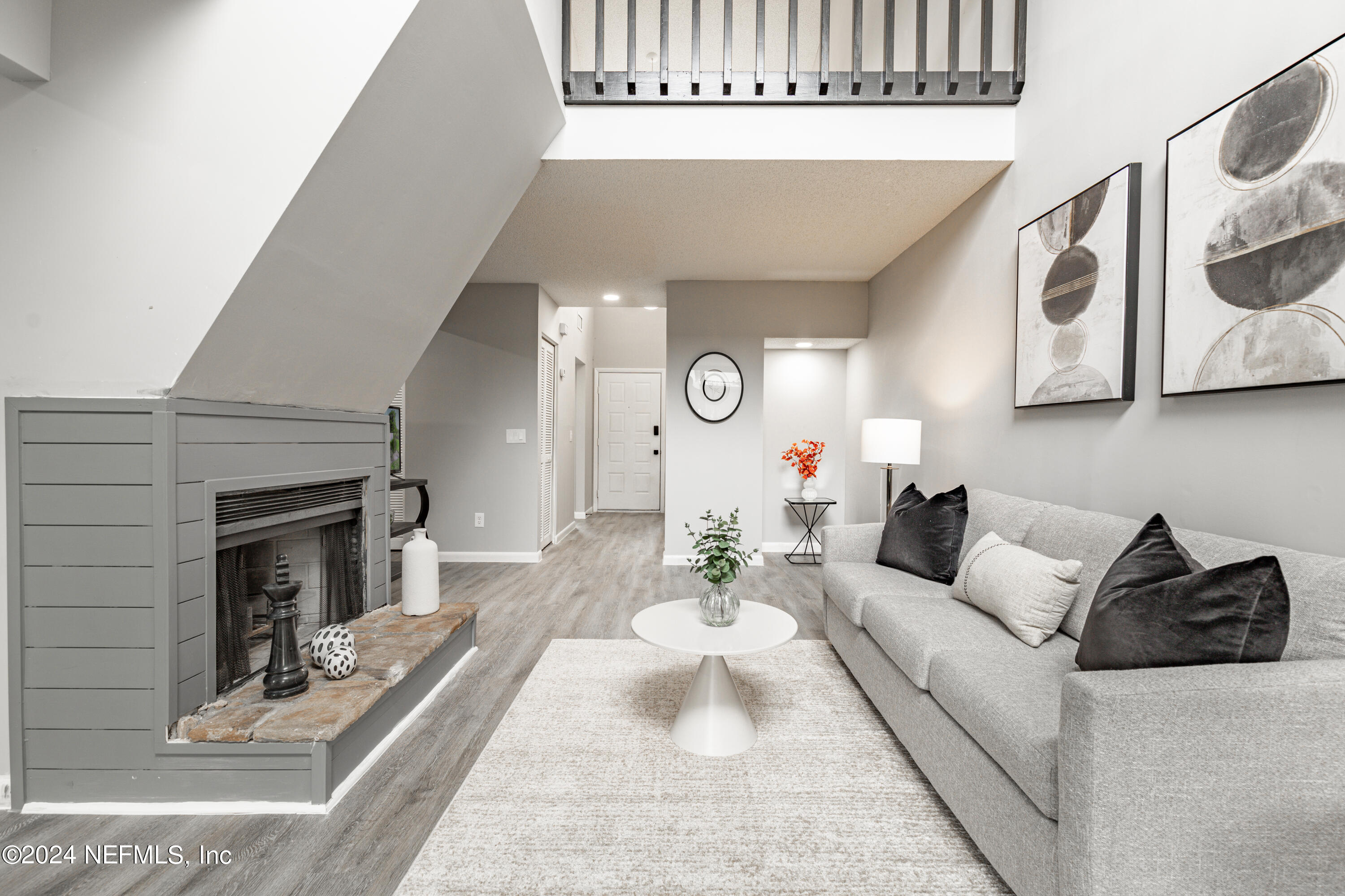 9360 Craven Road, Unit 504 Jacksonville, FL 32257 - Photo 8 of 28 a living room with furniture and a fireplace