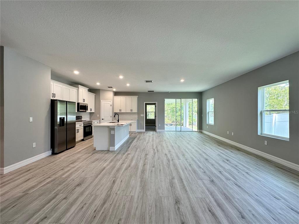 13081 Southwest 78th Circle Ocala, FL 34473 - Photo 2 of 22 a view of kitchen view wooden floor and window