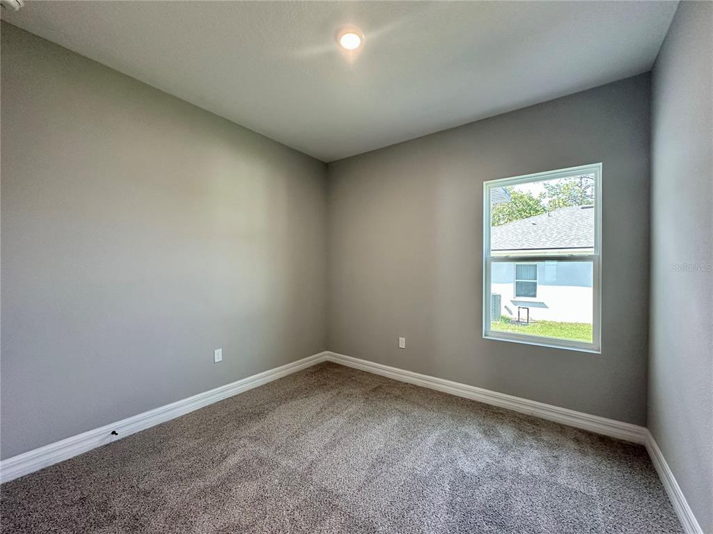13081 Southwest 78th Circle Ocala, FL 34473 - Photo 21 of 22 an empty room with a window