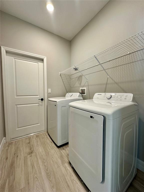 13081 Southwest 78th Circle Ocala, FL 34473 - Photo 22 of 22 a utility room with dryer and washer