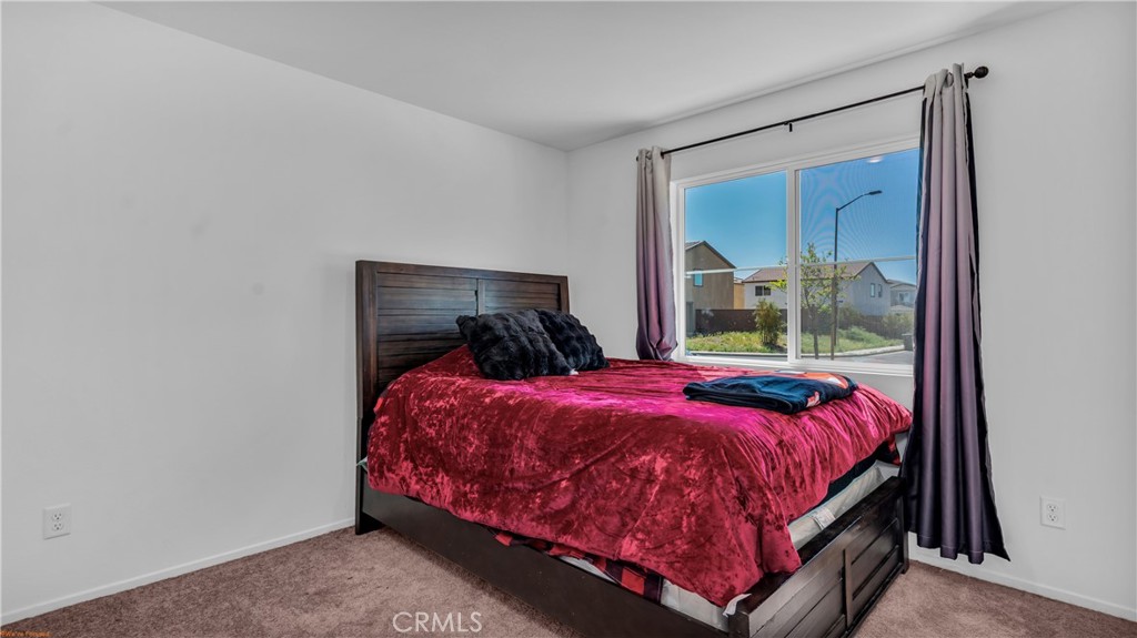 2271 Linden Lane Banning, CA 92220 - Photo 13 of 38 a bed sitting in a bedroom next to a window