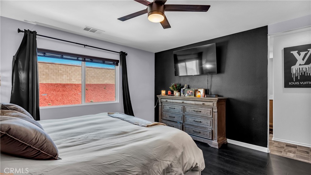 2271 Linden Lane Banning, CA 92220 - Photo 16 of 38 a bedroom with a bed and a window