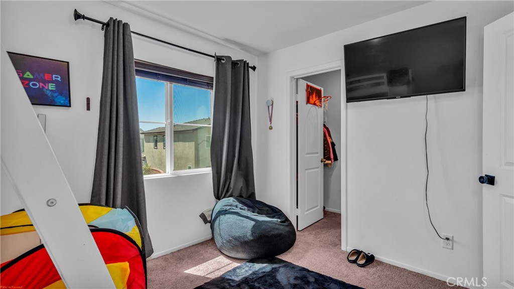 2271 Linden Lane Banning, CA 92220 - Photo 23 of 38 a living room with furniture and a flat screen tv