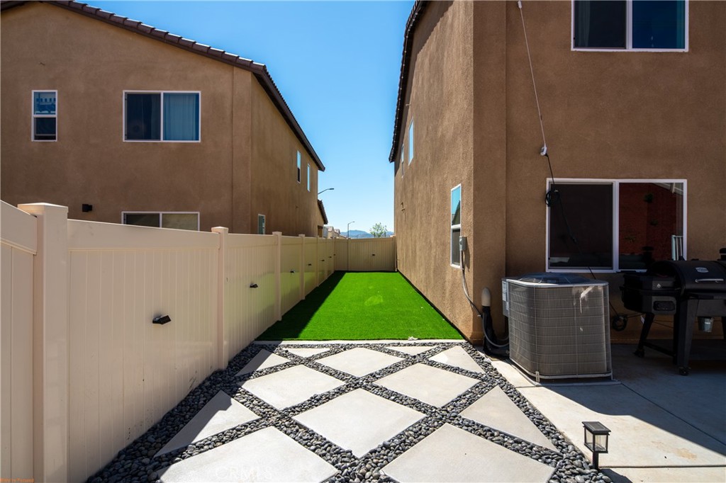 2271 Linden Lane Banning, CA 92220 - Photo 25 of 38 a backyard of a house with lots of green space and outdoor seating