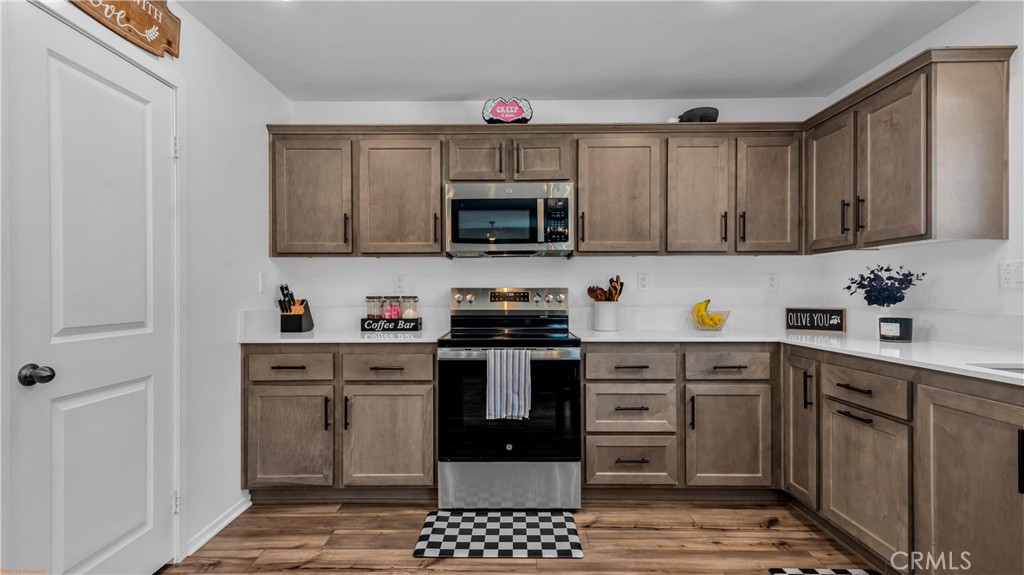 2271 Linden Lane Banning, CA 92220 - Photo 3 of 38 a kitchen with a sink cabinets and stainless steel appliances
