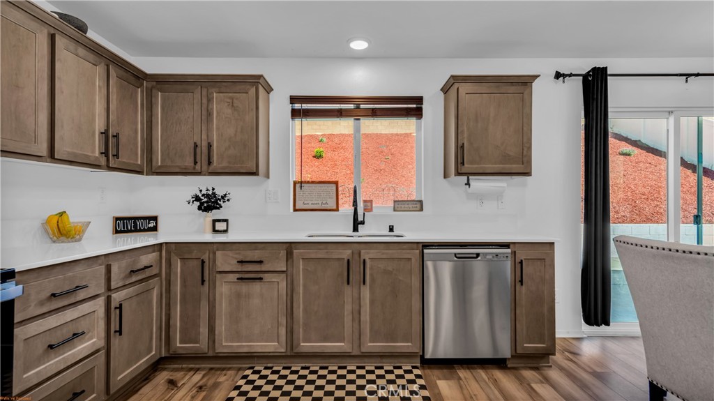 2271 Linden Lane Banning, CA 92220 - Photo 4 of 38 a kitchen with granite countertop a sink cabinets and stainless steel appliances