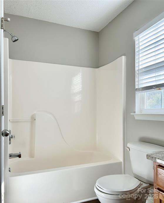 1021 Meadowbrook Lane Southwest Concord, NC 28027 - Photo 13 of 19 a bathroom with a toilet and a bathtub