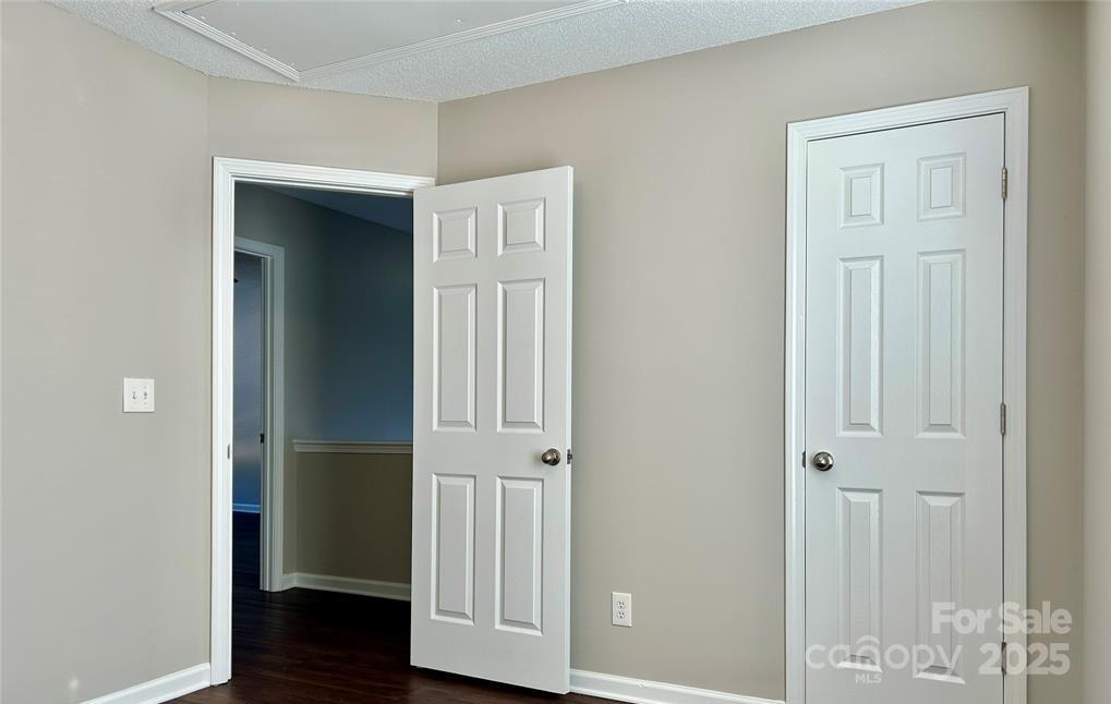 1021 Meadowbrook Lane Southwest Concord, NC 28027 - Photo 14 of 19 an entryway to room with wooden floor