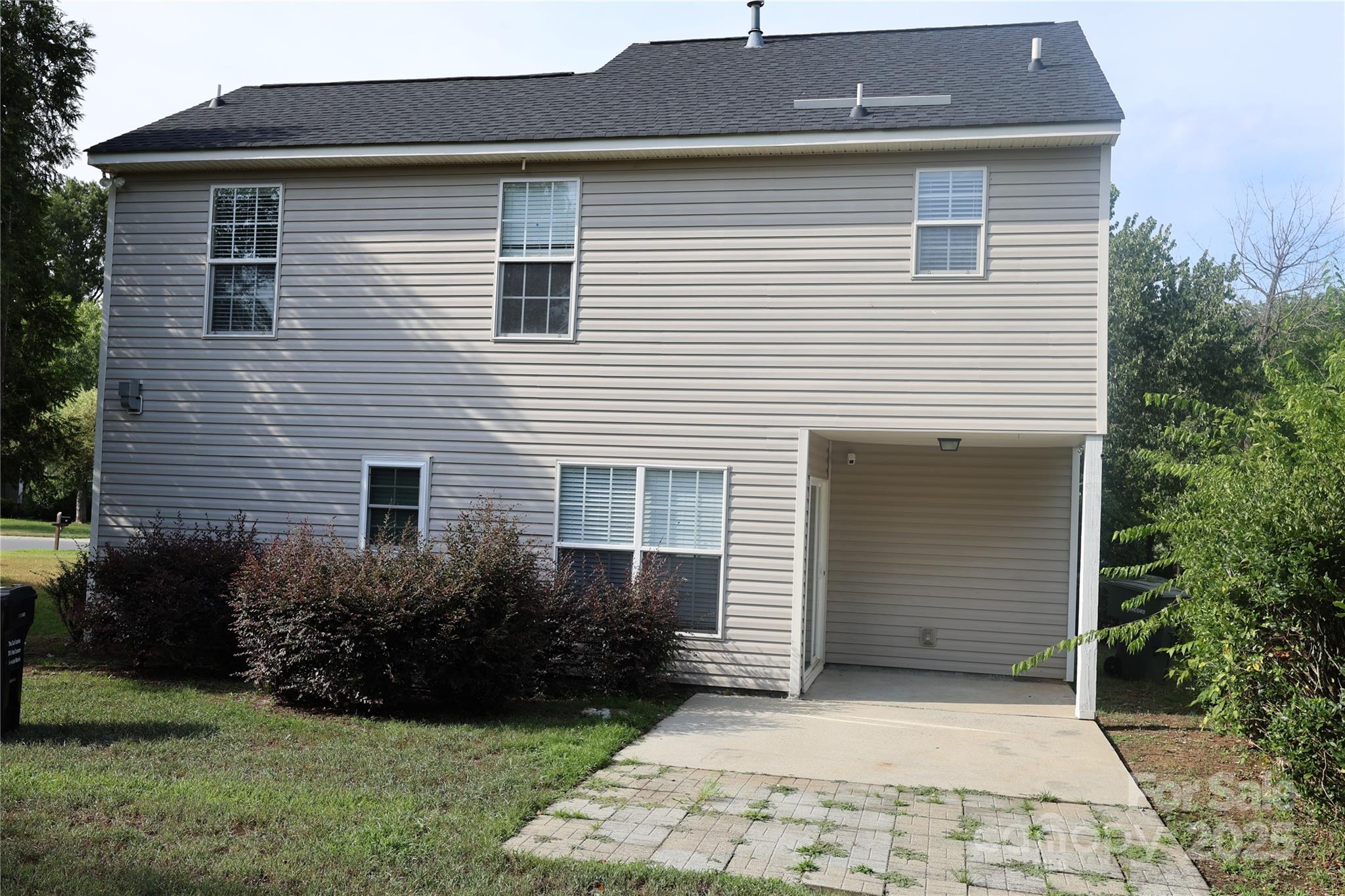 1021 Meadowbrook Lane Southwest Concord, NC 28027 - Photo 17 of 19 a front view of a house with garden