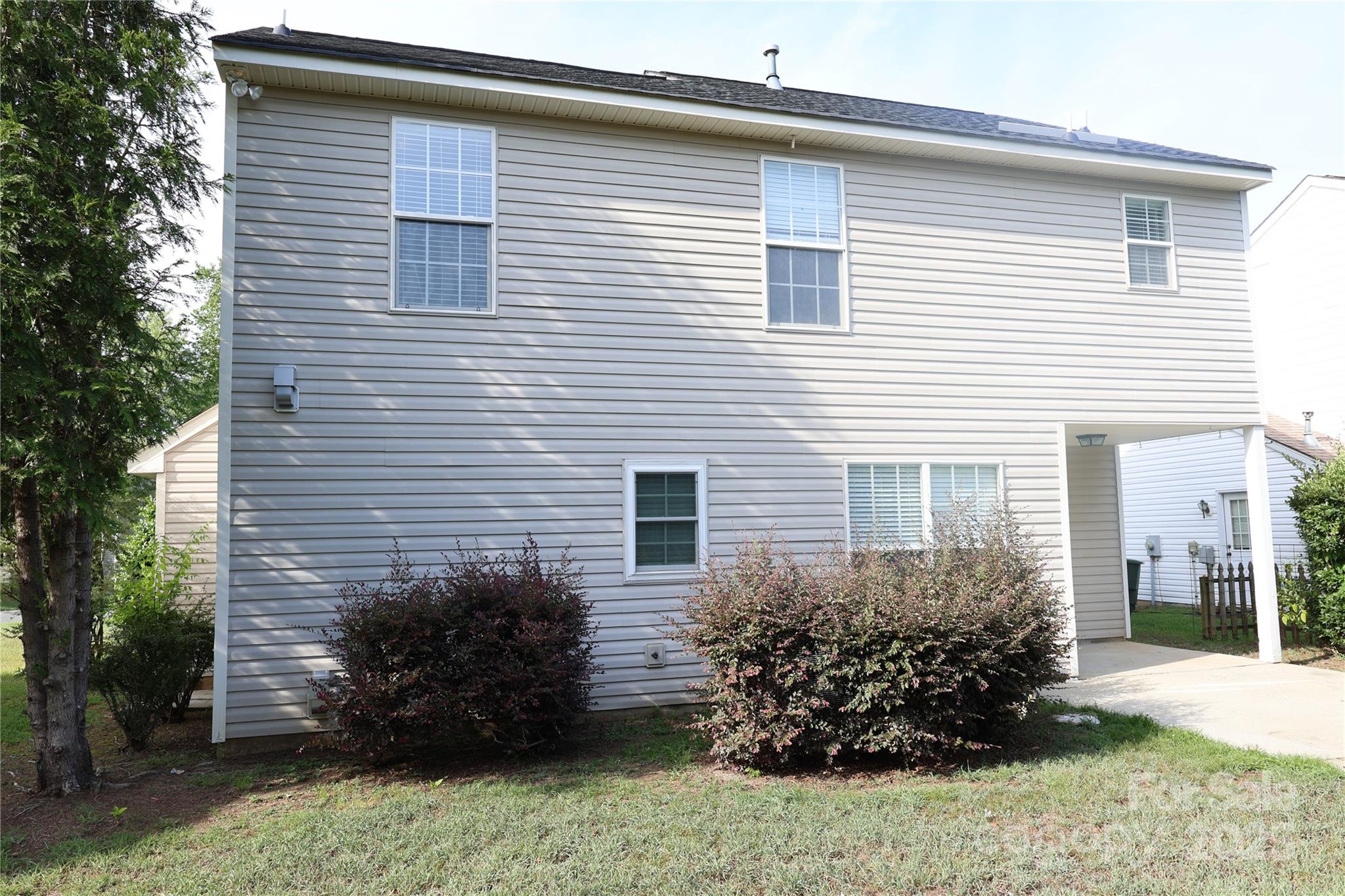 1021 Meadowbrook Lane Southwest Concord, NC 28027 - Photo 18 of 19 a view of a house with a yard