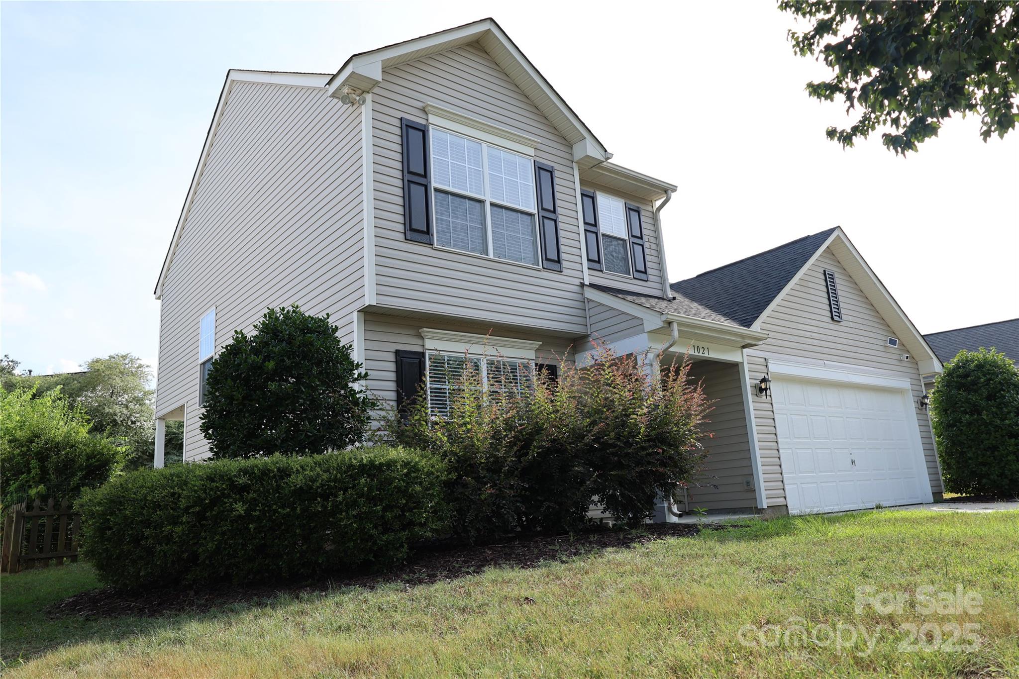 1021 Meadowbrook Lane Southwest Concord, NC 28027 - Photo 2 of 19 a view of a house with a garden