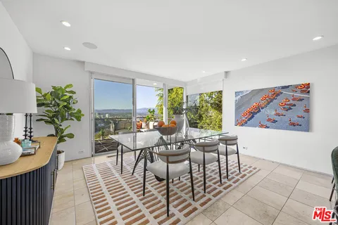 a bathroom with a tub sink and shower