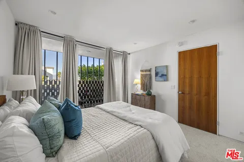 a view of swimming pool with outdoor seating and a patio