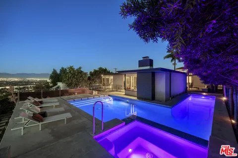 a view of a chairs with table in the patio