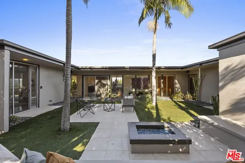 a kitchen with stainless steel appliances granite countertop a stove and a sink