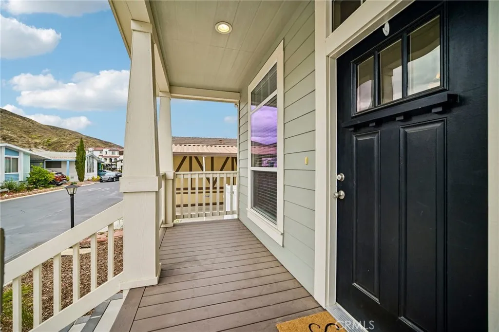 250 East Telegraph Road, Unit 307 Fillmore, CA 93015 - Photo 4 of 36 a view of a balcony with wooden floor and fence