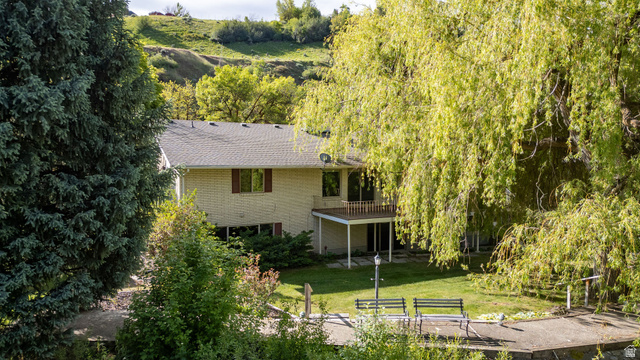 1365 Sumac Drive Logan, UT 84321 - Photo 8 of 66 Rear exterior with a second-story balcony and ground-level patio