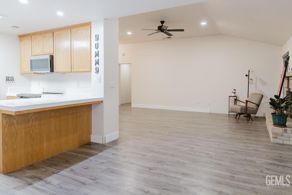 Undisclosed Address Bakersfield, CA 93308 - Photo 20 of 45 a view of a kitchen with a sink hardwood floor and a sink