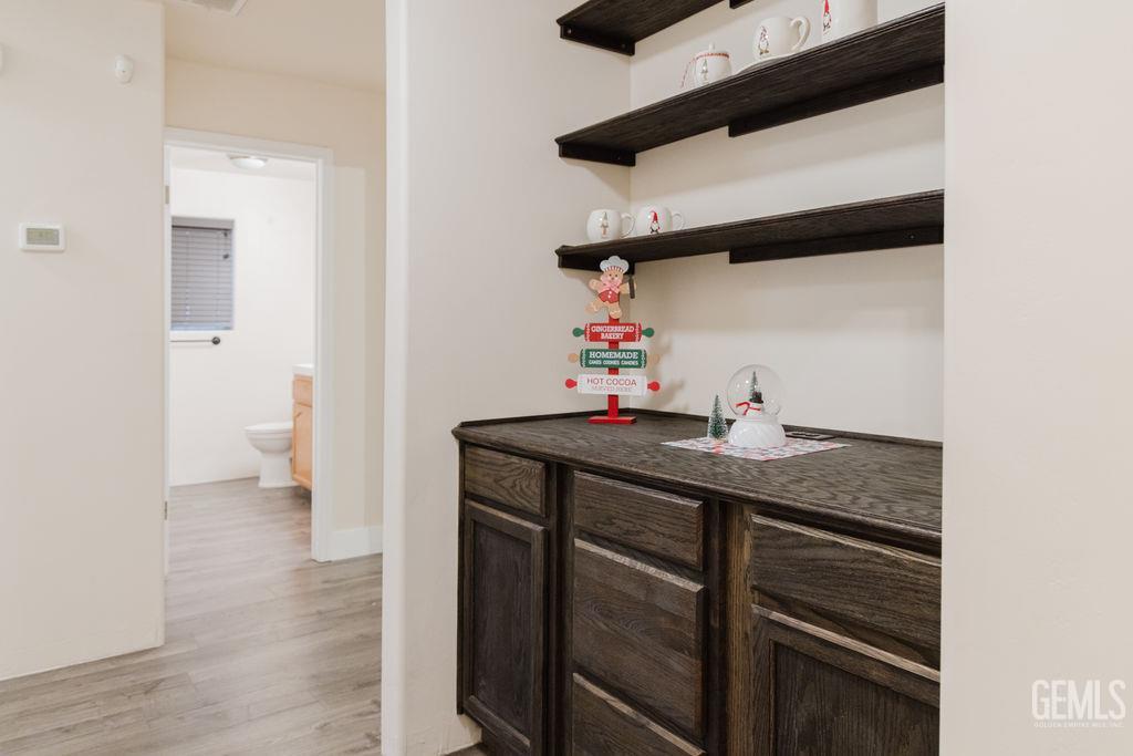 Undisclosed Address Bakersfield, CA 93308 - Photo 21 of 45 a kitchen with a sink and cabinets