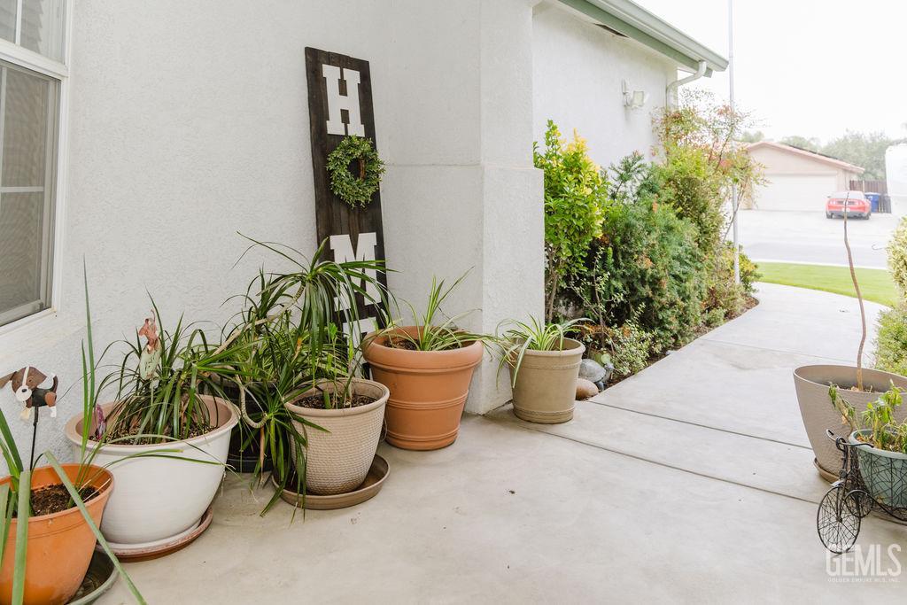 Undisclosed Address Bakersfield, CA 93308 - Photo 45 of 45 a view of a balcony with chair and potted plants