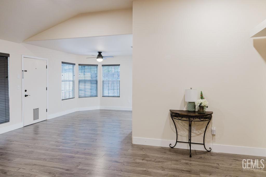 Undisclosed Address Bakersfield, CA 93308 - Photo 9 of 45 an empty room with windows and cabinet