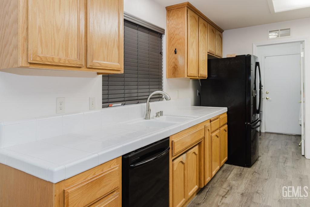 Undisclosed Address Bakersfield, CA 93308 - Photo 10 of 45 a kitchen with stainless steel appliances granite countertop a refrigerator and a sink