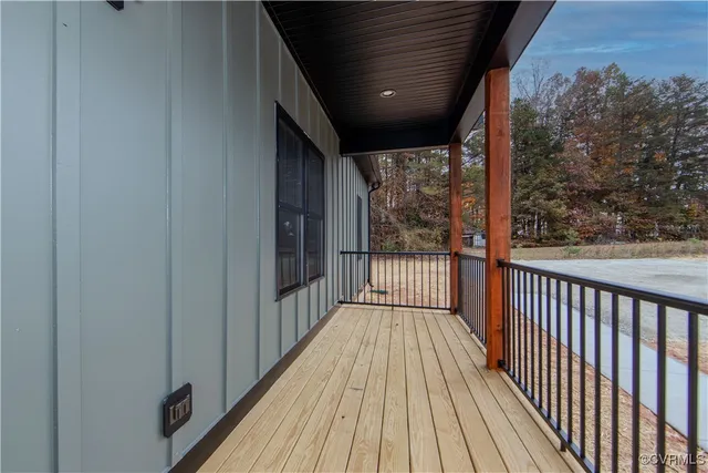 a view of balcony with wooden floor