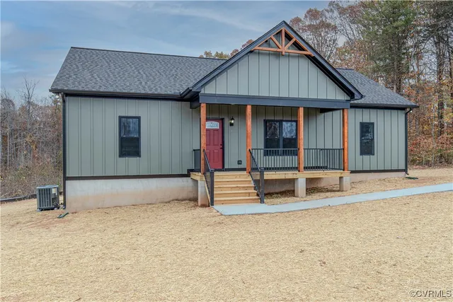a view of house with wooden floor and wooden fence