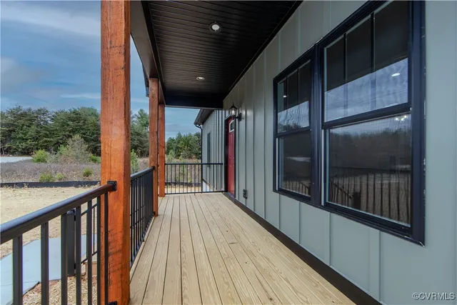 a view of a balcony with wooden floor