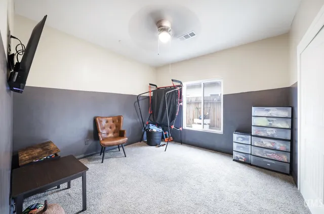 a bedroom with a bed and a night stand