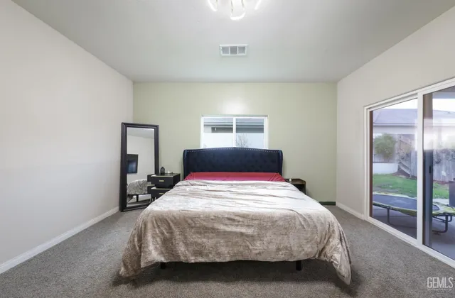 a bathroom with a double vanity sink mirror double and bathtub