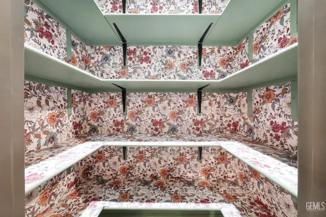 a large kitchen with stainless steel appliances granite countertop a stove and a sink