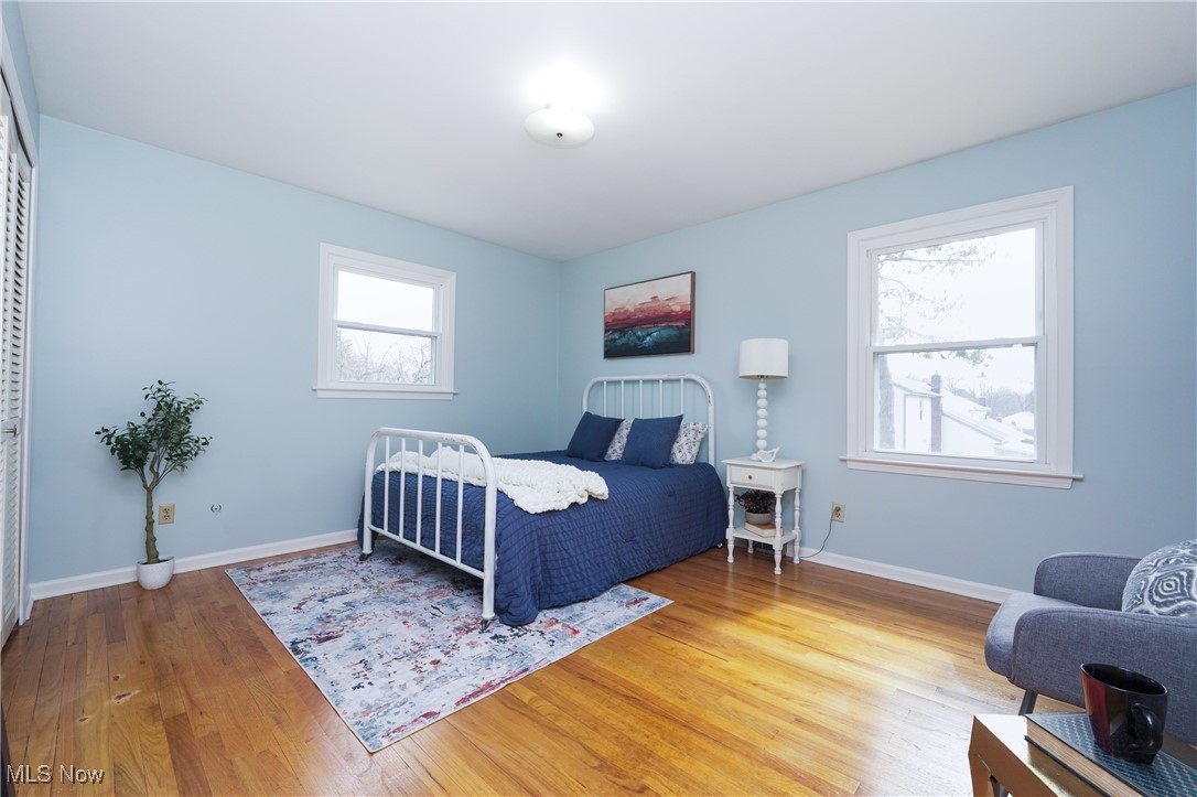 2674 Smith Road Fairlawn, OH 44333 - Photo 16 of 31 Bedroom with light wood-style floors and baseboards